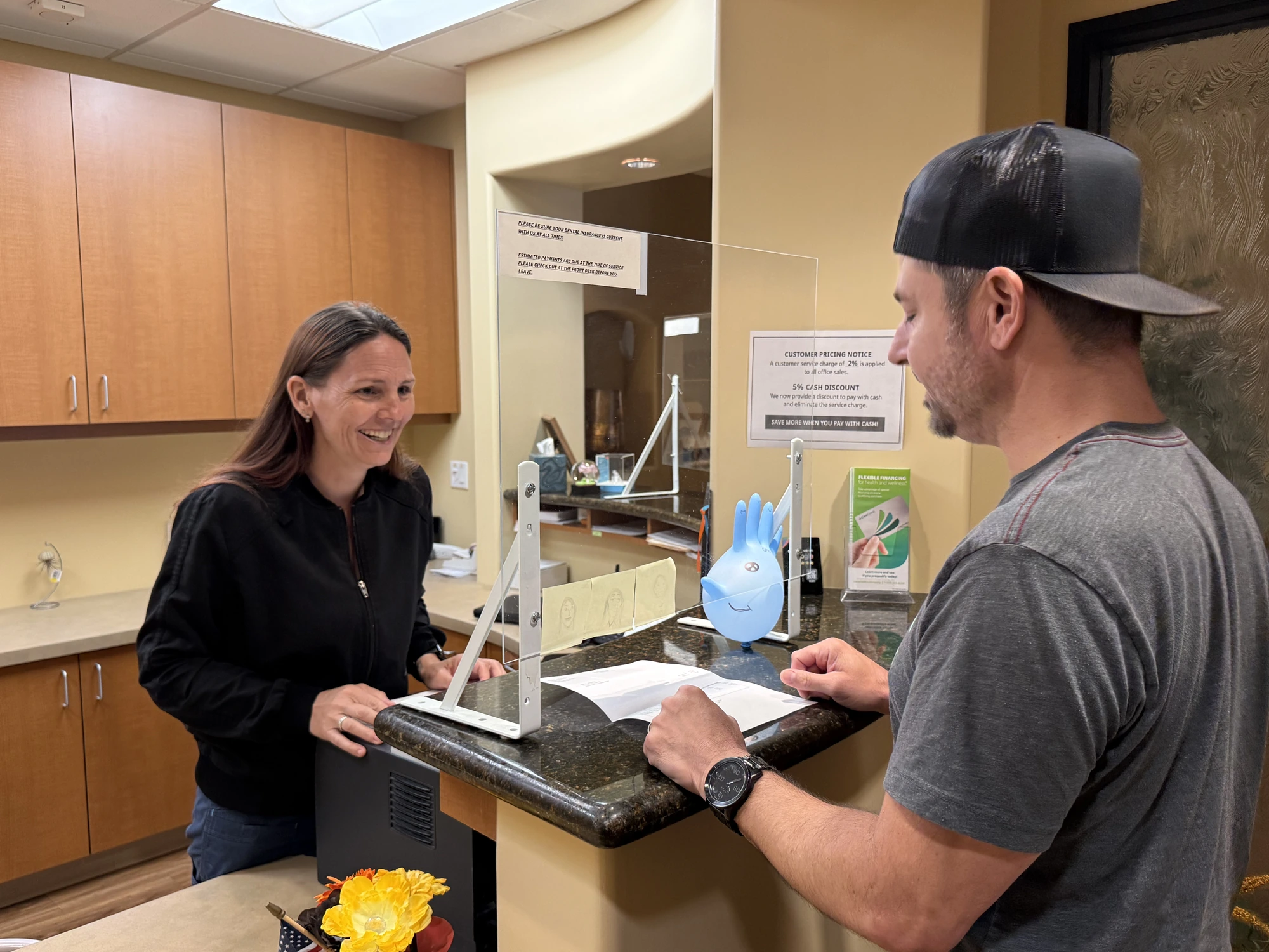 A patient smiling after teeth whitening