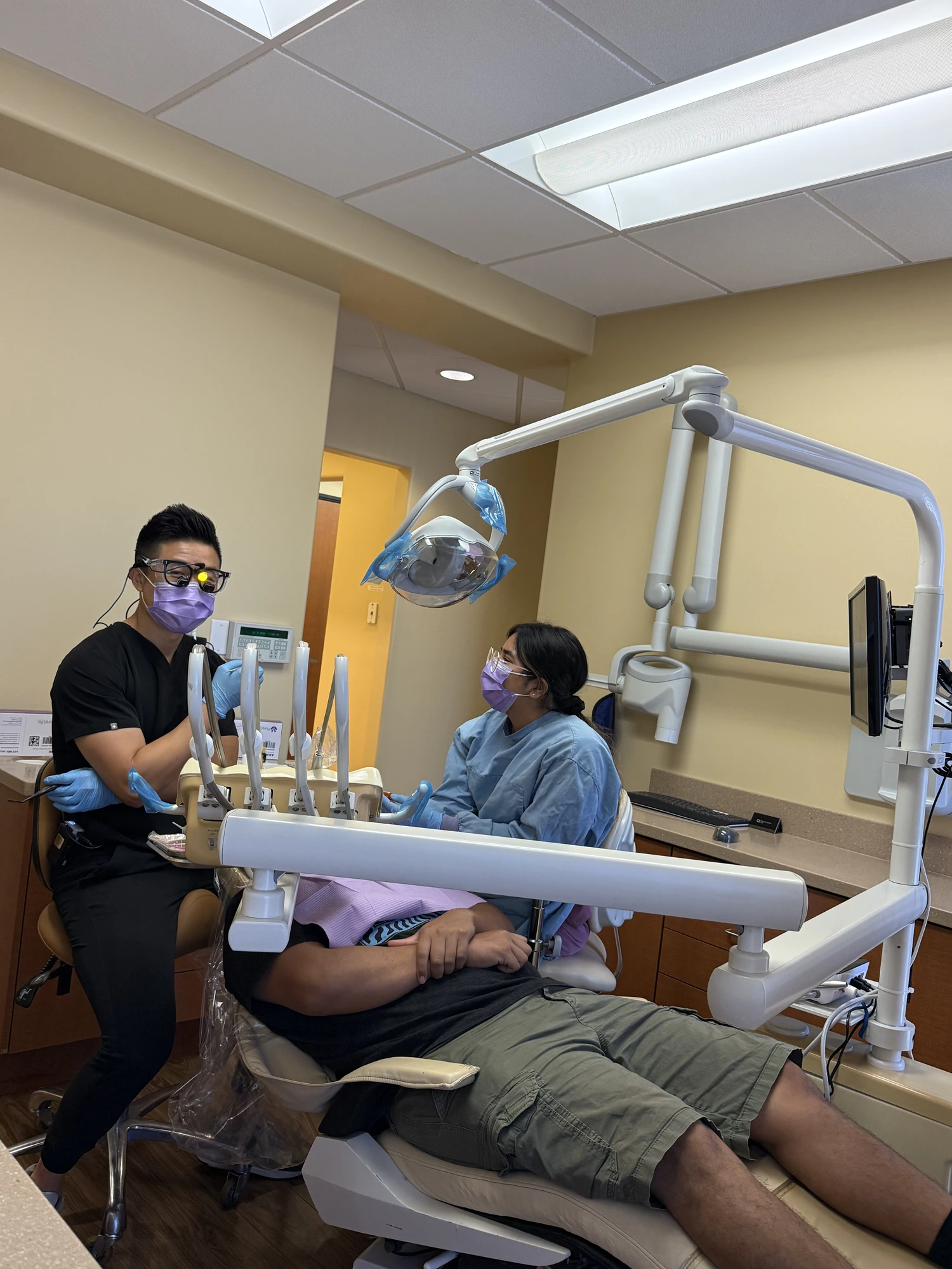 A patient smiling with Dr. Zhang at Zhang Dental Group