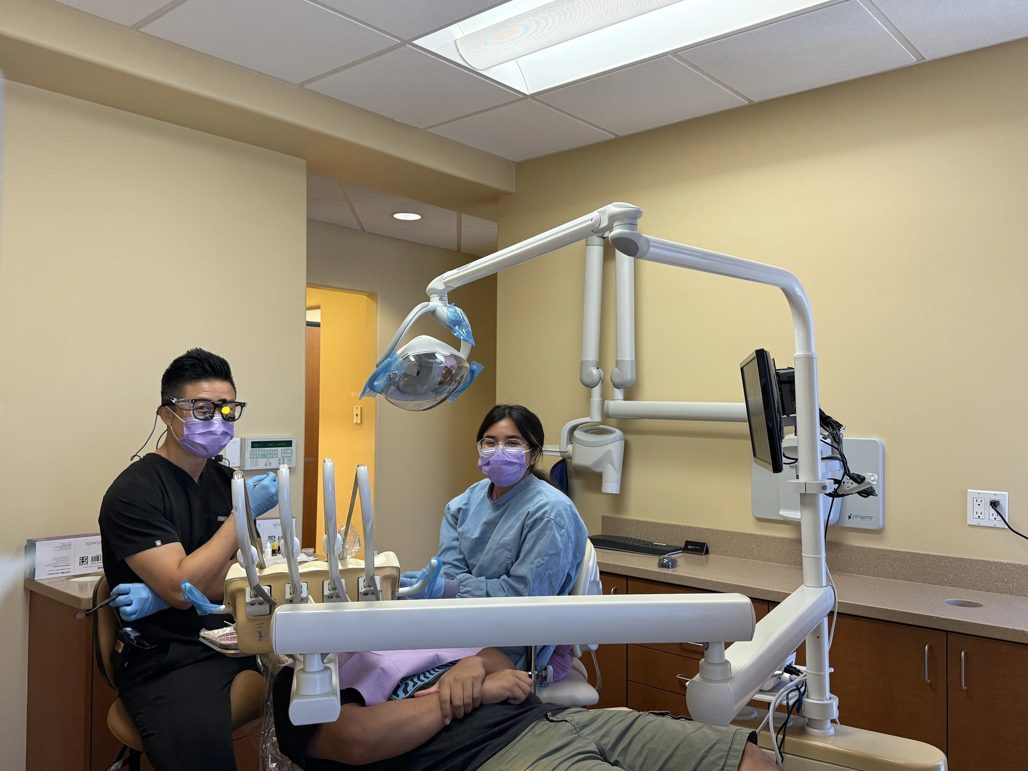 Dr. Zhang consulting with a patient about clear aligners